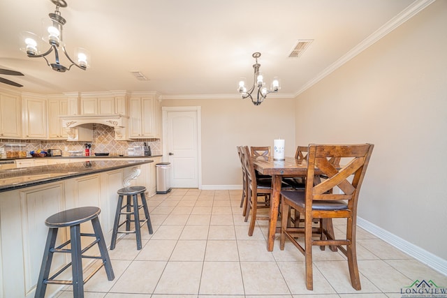 tiled dining room featuring a chandelier and crown molding