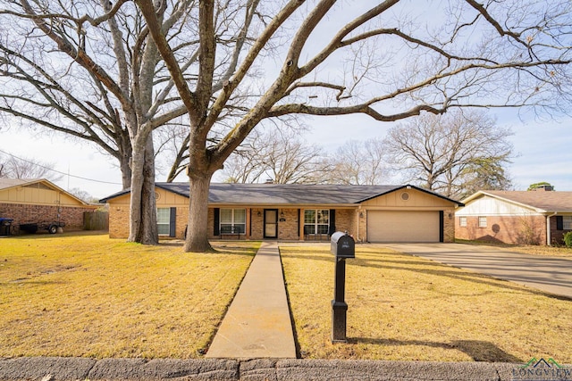 ranch-style house with a front yard and a garage