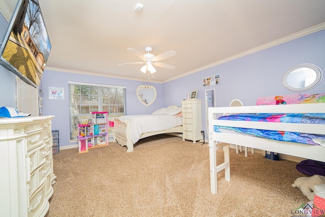 bedroom with ceiling fan, crown molding, and carpet floors