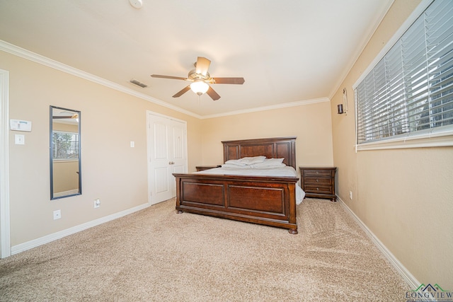 bedroom with ornamental molding, ceiling fan, and light carpet