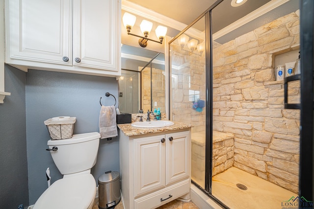 bathroom featuring vanity, crown molding, a shower with shower door, and toilet