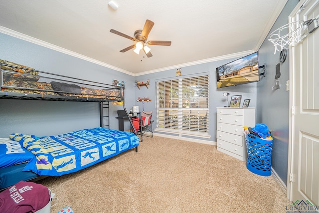 carpeted bedroom with ceiling fan and ornamental molding