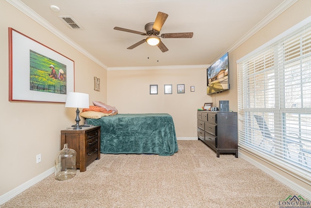 carpeted bedroom featuring ceiling fan and ornamental molding