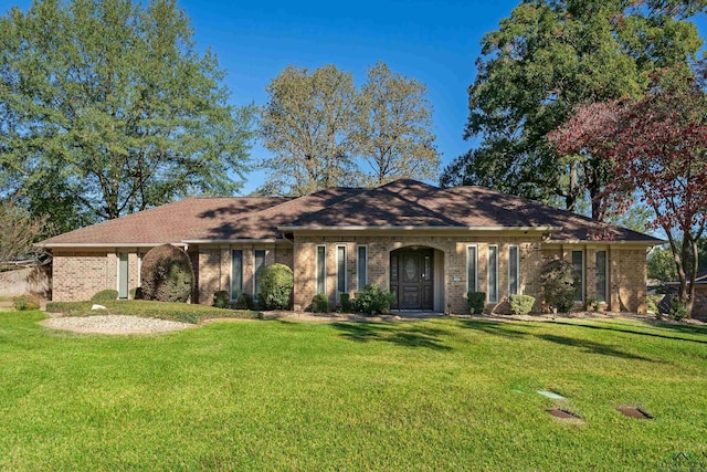 ranch-style house with a front lawn