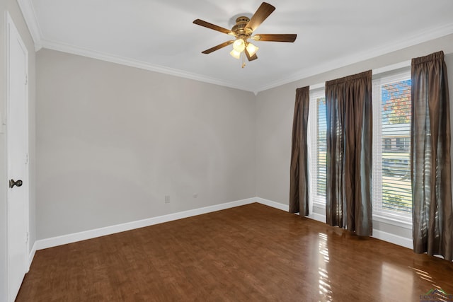 spare room featuring dark hardwood / wood-style flooring, ceiling fan, and crown molding