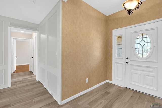 entryway with light hardwood / wood-style floors