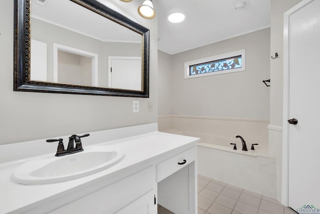 bathroom featuring a bath, vanity, and tile patterned floors