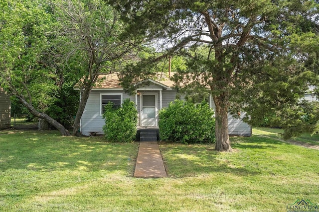obstructed view of property featuring a front yard