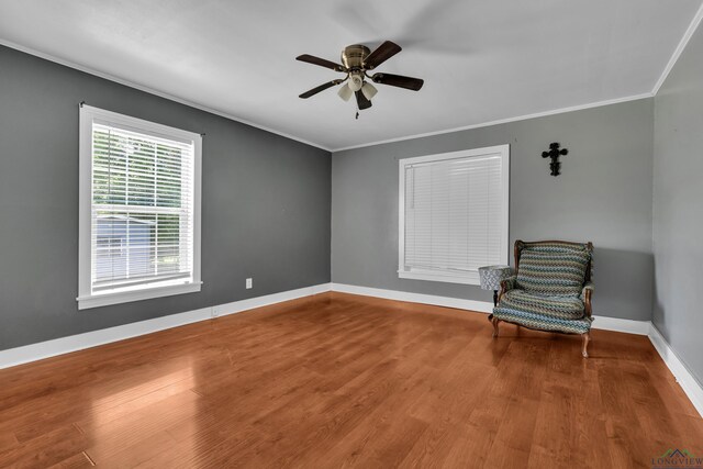 300 Hailey Dr, Longview, TX 75602 - unfurnished room with wood finished floors, a ceiling fan, ornamental molding, and baseboards