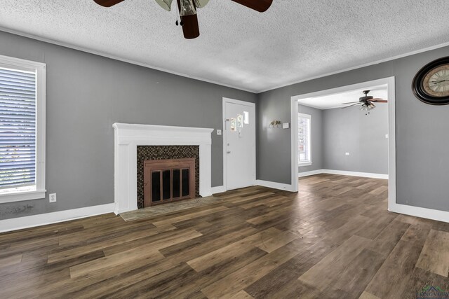 300 Hailey Dr, Longview, TX 75602 - unfurnished living room with ceiling fan, dark wood finished floors, and a textured ceiling