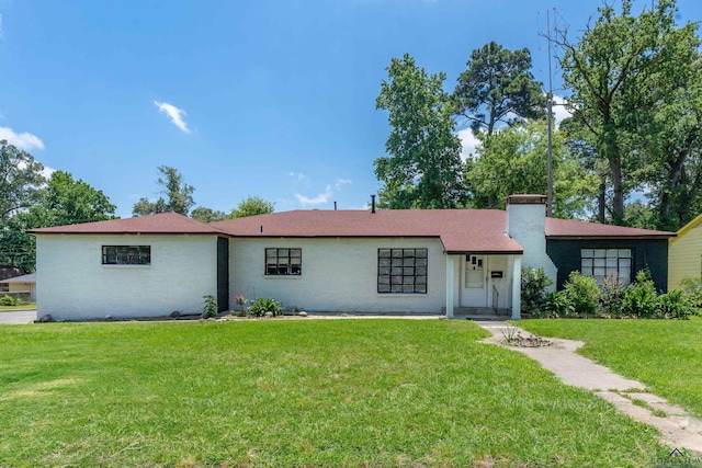 300 Hailey Dr, Longview, TX 75602 - ranch-style house featuring a front yard and a chimney
