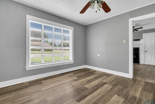 300 Hailey Dr, Longview, TX 75602 - unfurnished room featuring a ceiling fan, wood finished floors, a textured ceiling, baseboards, and crown molding
