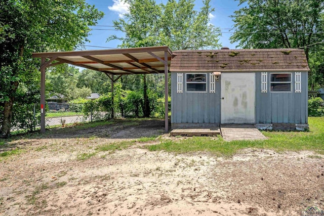 300 Hailey Dr, Longview, TX 75602 - view of shed with a carport and dirt driveway