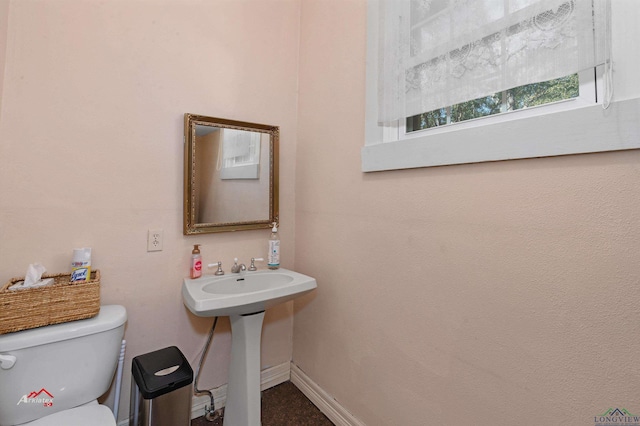 bathroom with toilet and sink