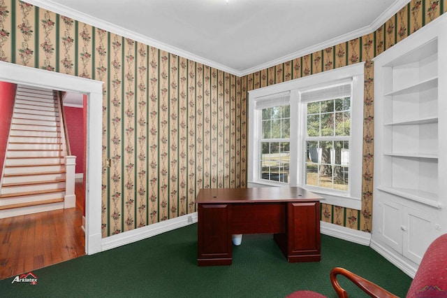 office with hardwood / wood-style flooring, built in shelves, and crown molding