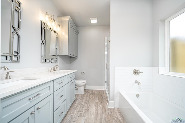 126 Lakeway Ln, Longview, TX 75604 - bathroom with a bath, a sink, double vanity, and toilet