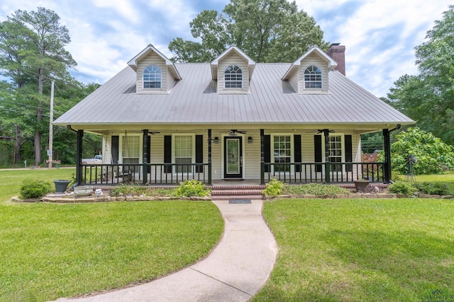 view of front of house with covered porch and a front lawn