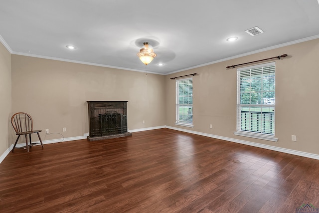 unfurnished living room featuring ornamental molding, a brick fireplace, ceiling fan, and dark wood-type flooring