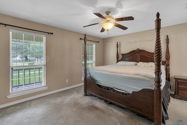 bedroom featuring ceiling fan and light carpet