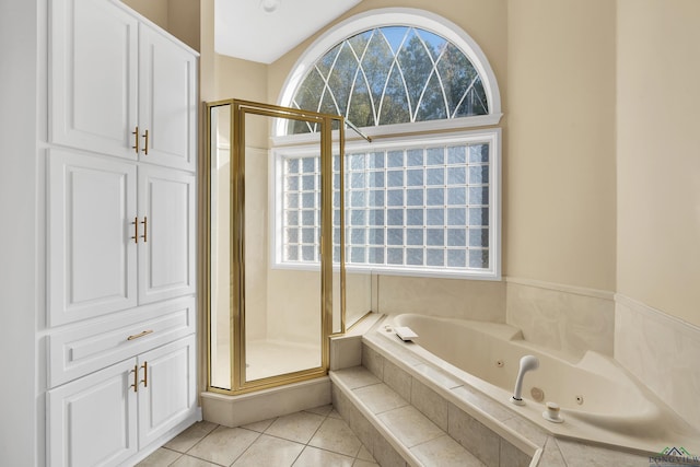 bathroom with a healthy amount of sunlight, tile patterned flooring, and shower with separate bathtub