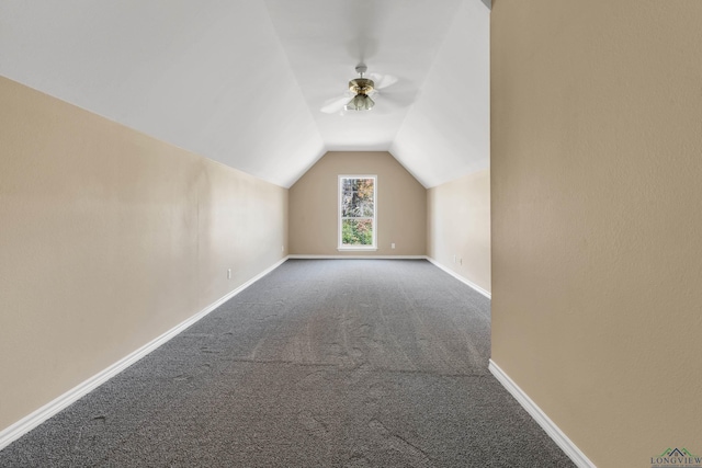 additional living space with vaulted ceiling, ceiling fan, and carpet