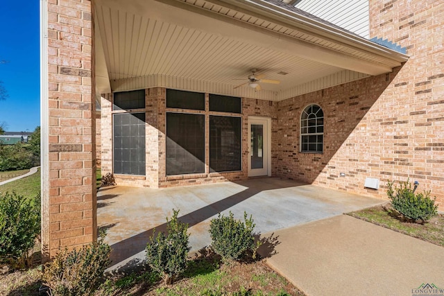 property entrance featuring ceiling fan and a patio