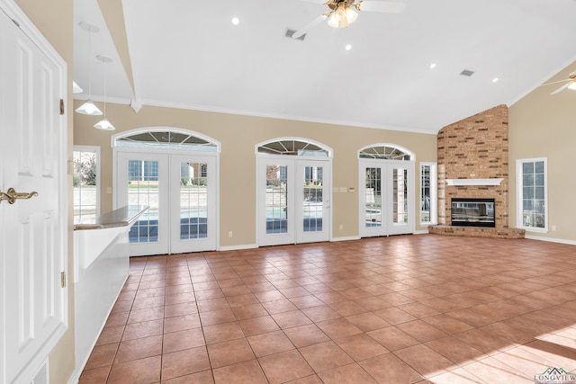 unfurnished living room with ceiling fan, light tile patterned floors, and french doors