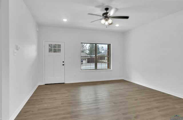 entrance foyer featuring dark hardwood / wood-style floors and ceiling fan