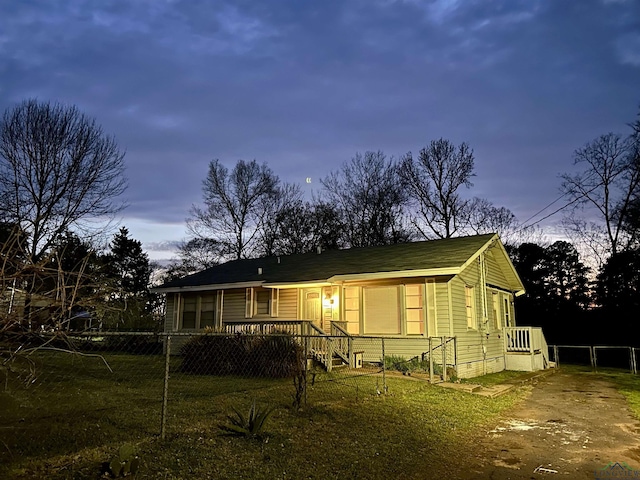 view of front of home featuring fence