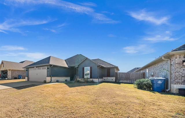 single story home featuring a front yard and a garage