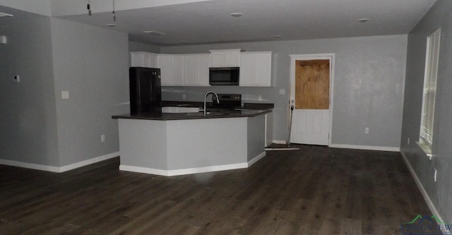 kitchen featuring white cabinetry, dark wood-type flooring, sink, and black appliances