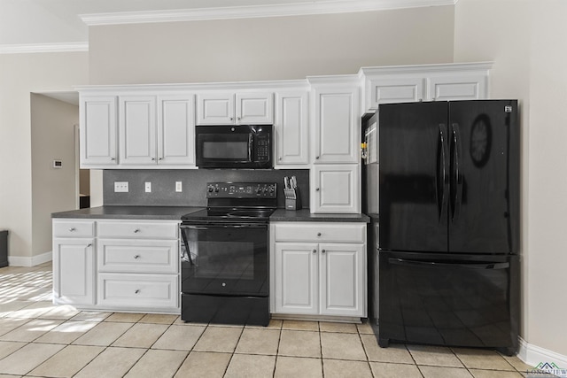 kitchen featuring black appliances, white cabinets, light tile patterned floors, and crown molding