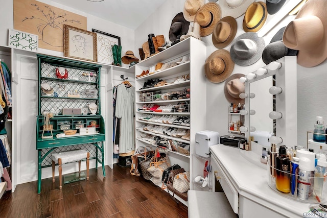 spacious closet with dark wood-type flooring