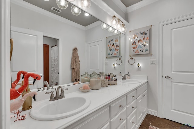 bathroom with crown molding and vanity