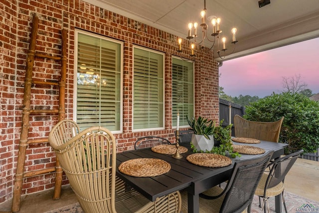 view of patio terrace at dusk