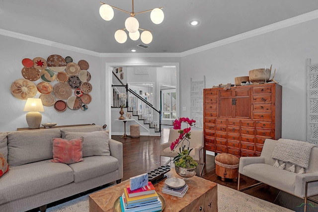 living room with dark hardwood / wood-style flooring, an inviting chandelier, and crown molding