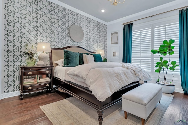 bedroom featuring crown molding and dark hardwood / wood-style flooring