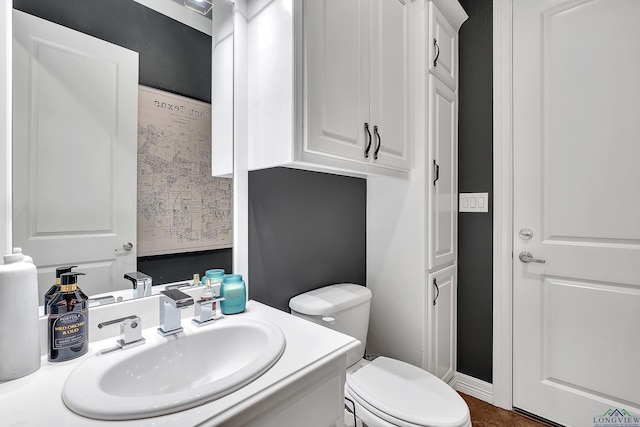 bathroom featuring sink and toilet