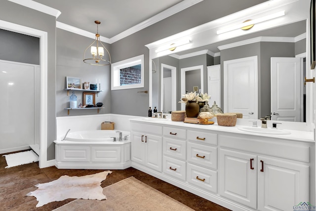 bathroom featuring tile patterned flooring, vanity, a tub to relax in, and a notable chandelier