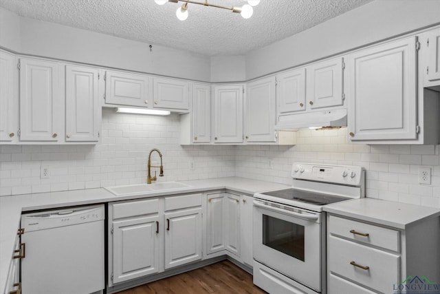 204 Half St, Lindale, TX 75771 - kitchen featuring white appliances, under cabinet range hood, a sink, a textured ceiling, and white cabinets