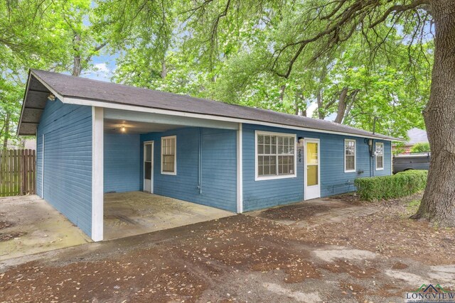 204 Half St, Lindale, TX 75771 - view of front of home with an attached carport and a patio area