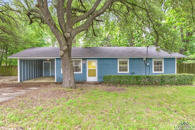 204 Half St, Lindale, TX 75771 - ranch-style house featuring a carport and driveway