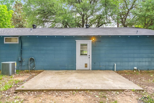 204 Half St, Lindale, TX 75771 - rear view of house with central AC unit and a patio area
