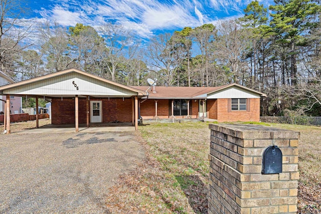 ranch-style house with a carport