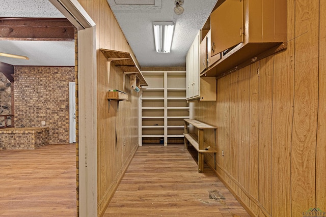 spacious closet featuring light hardwood / wood-style flooring