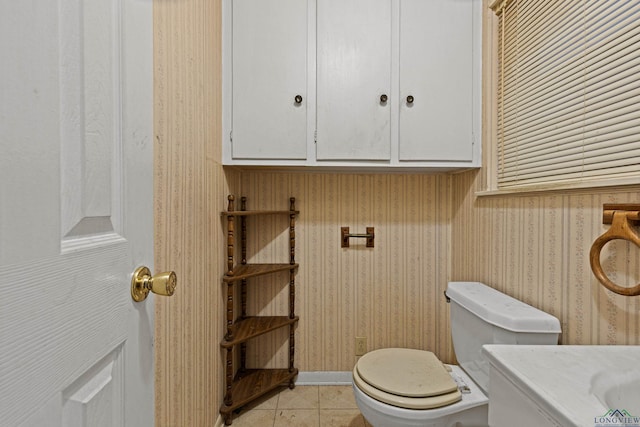 bathroom featuring tile patterned flooring and toilet