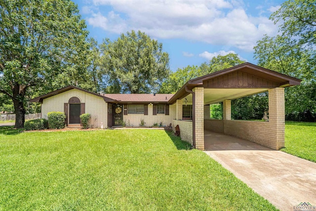 207 E Eleanor St, Gladewater, TX 75647 - view of front of house with brick siding, concrete driveway, a front lawn, and a carport