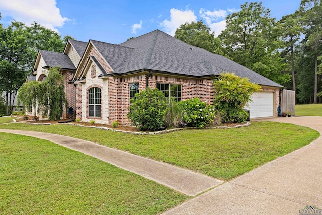 1844 Raven Rd, Diana, TX 75640 - view of front of property featuring brick siding, roof with shingles, a garage, concrete driveway, and a front yard