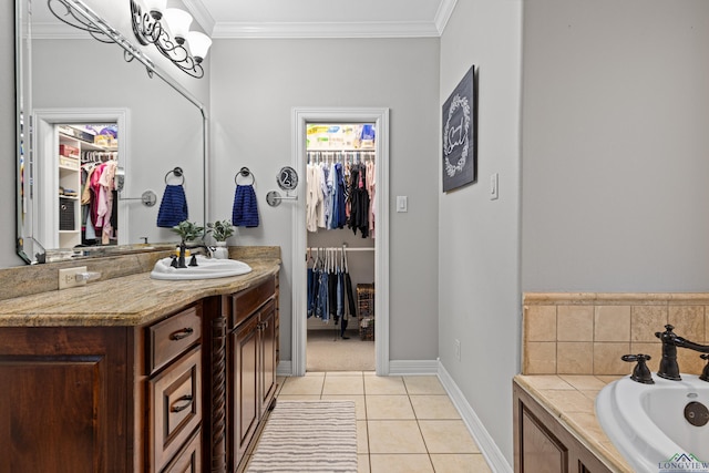 1844 Raven Rd, Diana, TX 75640 - full bath featuring vanity, a spacious closet, tile patterned flooring, a bath, and ornamental molding