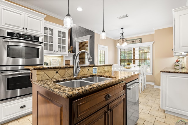 1844 Raven Rd, Diana, TX 75640 - kitchen with appliances with stainless steel finishes, a sink, backsplash, white cabinetry, and dark stone countertops